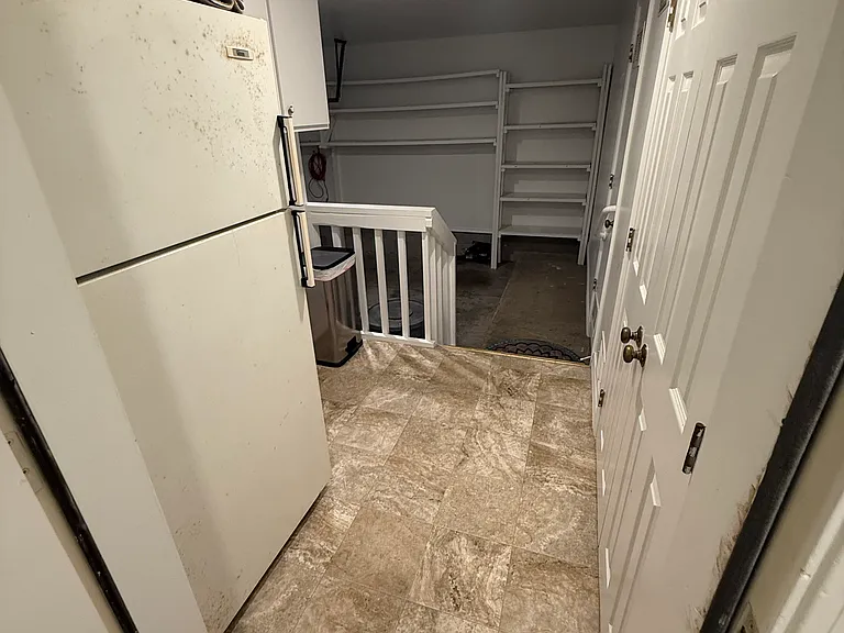 Garage Landing with extra refrigerator.