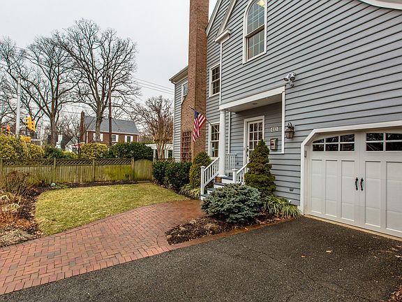 Attached garage & incredible landscaping