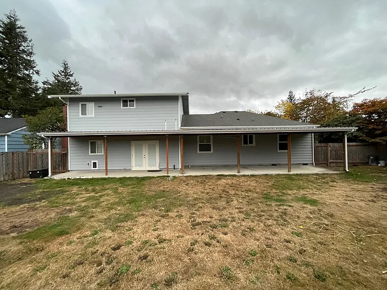 Exterior Back. Covered porch shown.