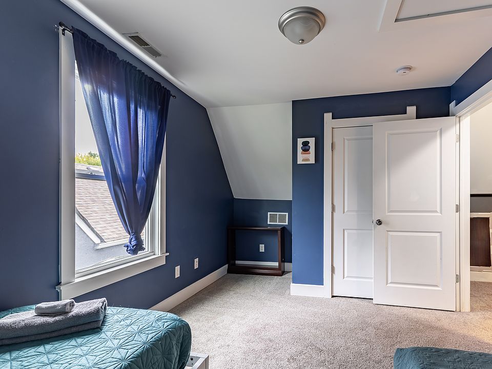 Two comfortable beds in a sunny, cheerful room ___