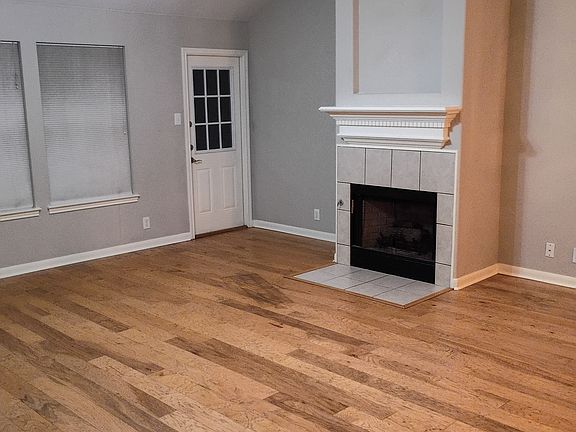 living room with wood burning fireplace