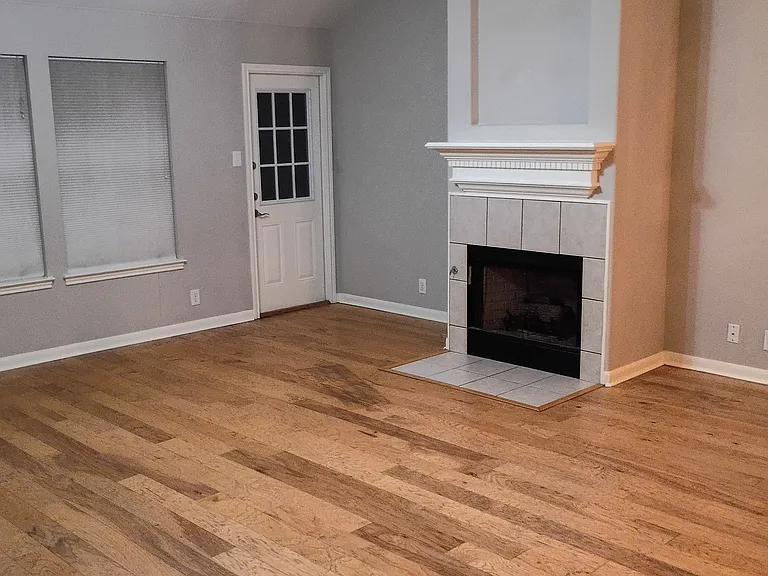 living room with wood burning fireplace