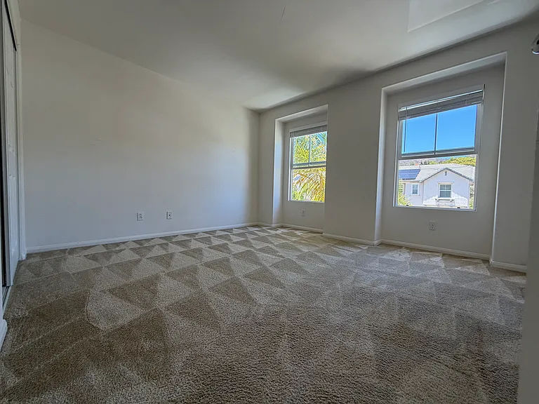 Guest bedroom two with windows