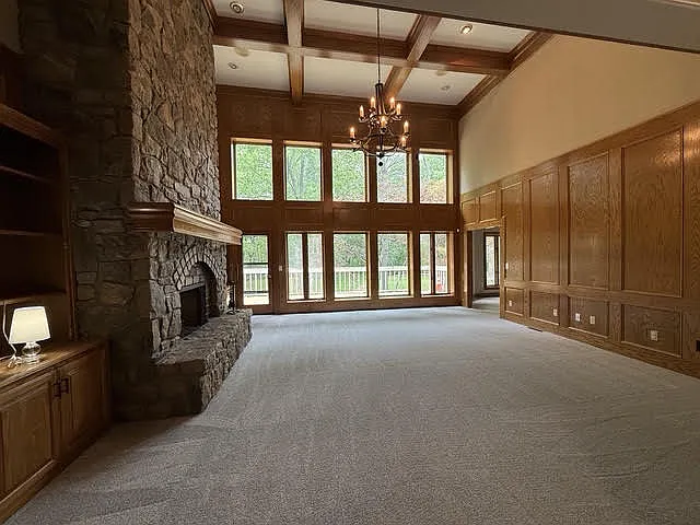 New Carpet, Gathering Room with high ceilings and daylight windows.