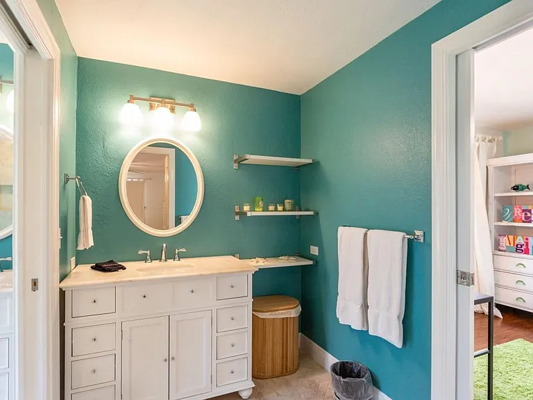 Master bathroom with view of second bedroom