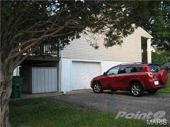 This parking pad/drive will hold four cars...