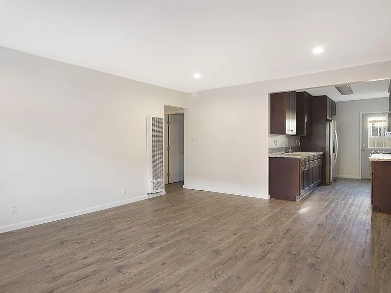 entry to living room and kitchen with new recessed lighting