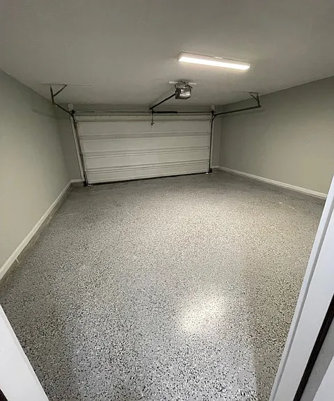 Fully redone 2 car attached garage with newly epoxy finished floor and paint and new lighting