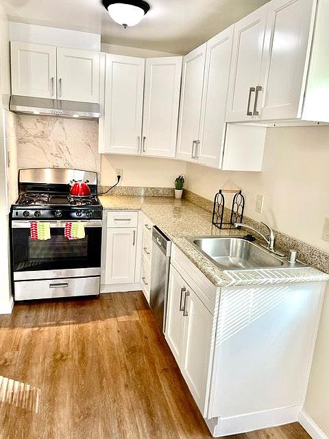 Kitchen with new appliances, granite countertops and new cabinetry