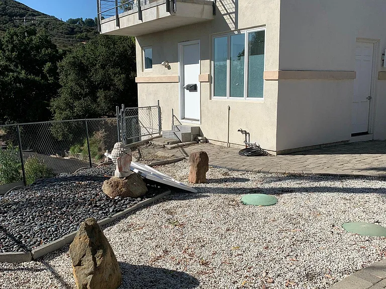 Private entrance. Unit is not attached to the home. Private patio shown on second floor