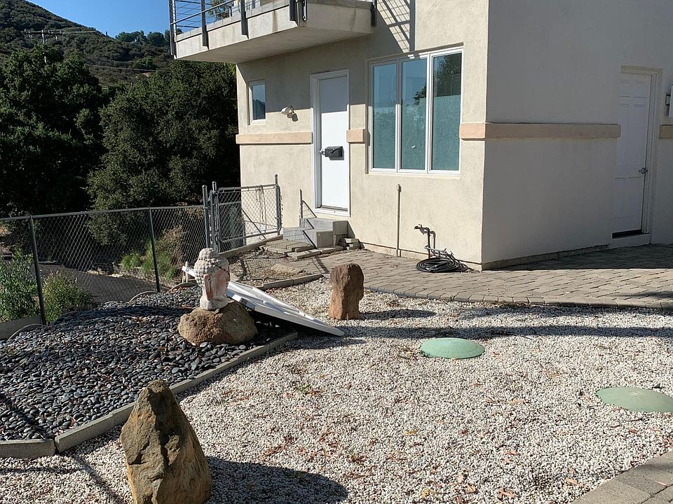 Private entrance. Unit is not attached to the home. Private patio shown on second floor