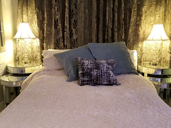 Queen size comfortable bed with luxury linens for winter and summer