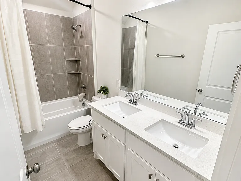 Full bathroom, view from hallway by bedrooms #1 and #2 as well as laundry room
