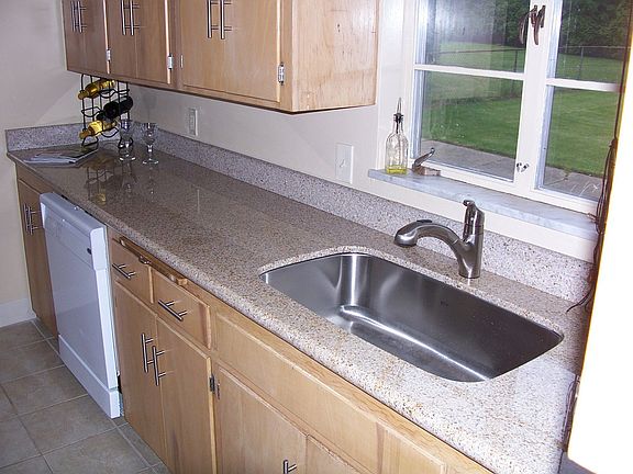 Kitchen-Newly installed granite countertop, sink basin & faucet.  