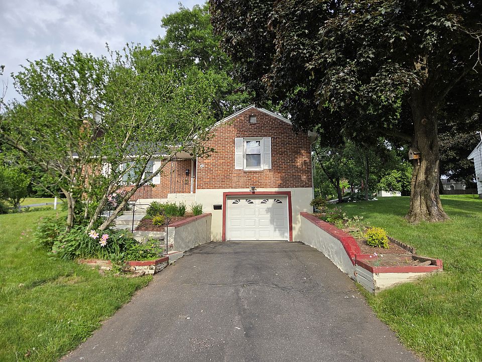Entrance through the garage to the lower basement level or up the stairs to the main level.