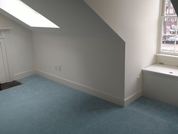 Bedroom with brand new carpet.