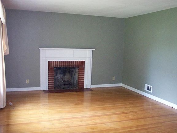 Gas Fireplace located in the 20 X 13'6" Living Room with nice hardwood floor.