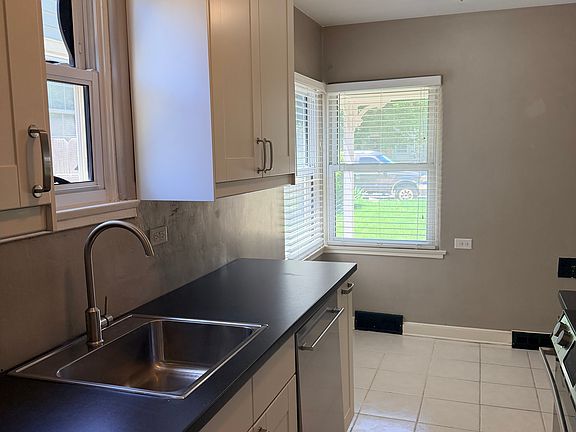 The eat-in kitchen has a sunlit area big enough for a table and 4 chairs under the windows. Recently installed appliances, and cabinets were recently updated.