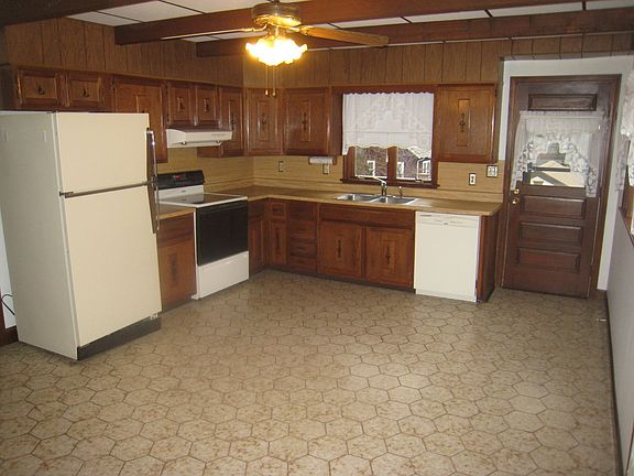Eat-in kitchen - Fridge, dishwasher, disposal and range. Cabinets refinished.