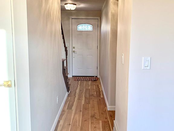 Entry hall, view from rear living area towards front door.