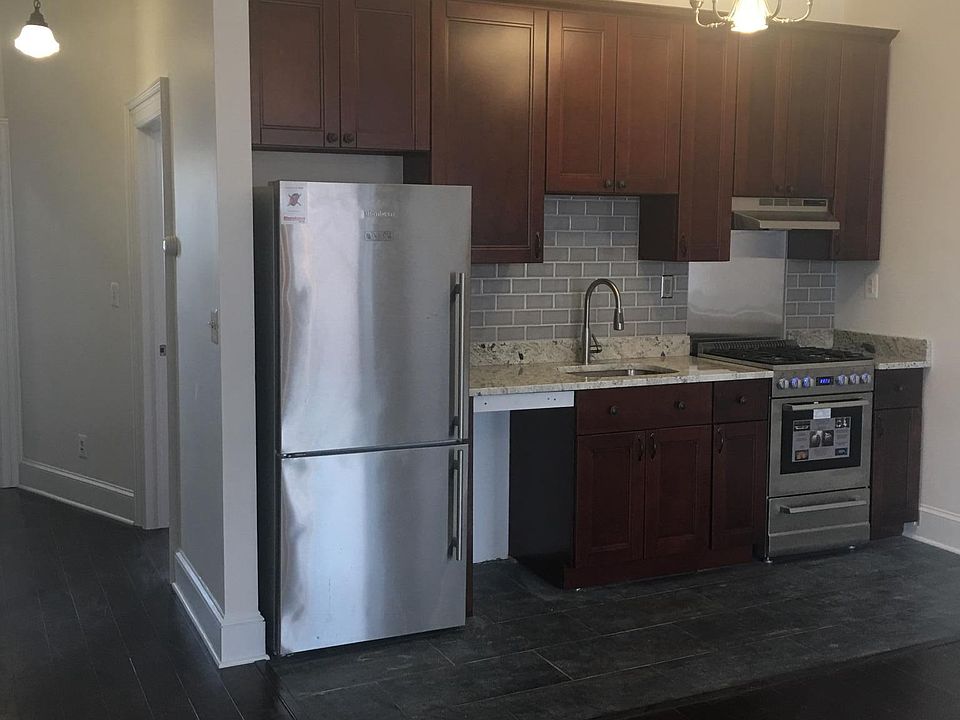Tiles in the kitchen area. All new Cabinets, stainless steel