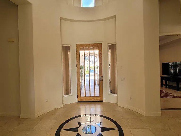 Large entryway into a large living space