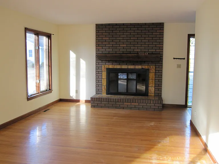 Living room with working wood-burning fireplace