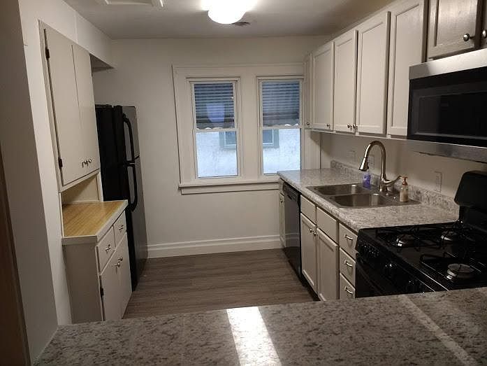 Updated kitchen with new dishwasher, stove, microwave. Granite countertop between kitchen and living room.