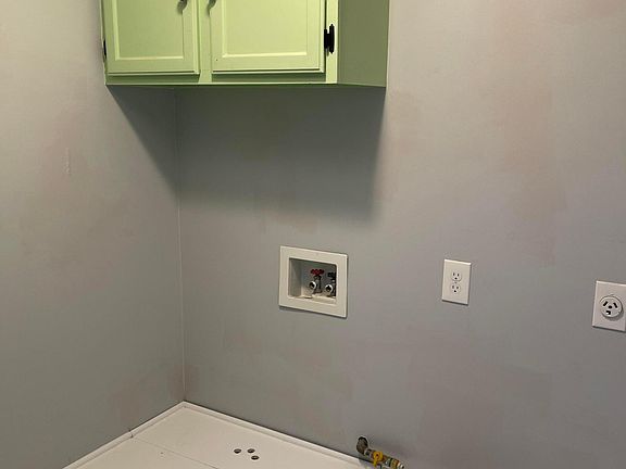 Laundry hook up with built in riser