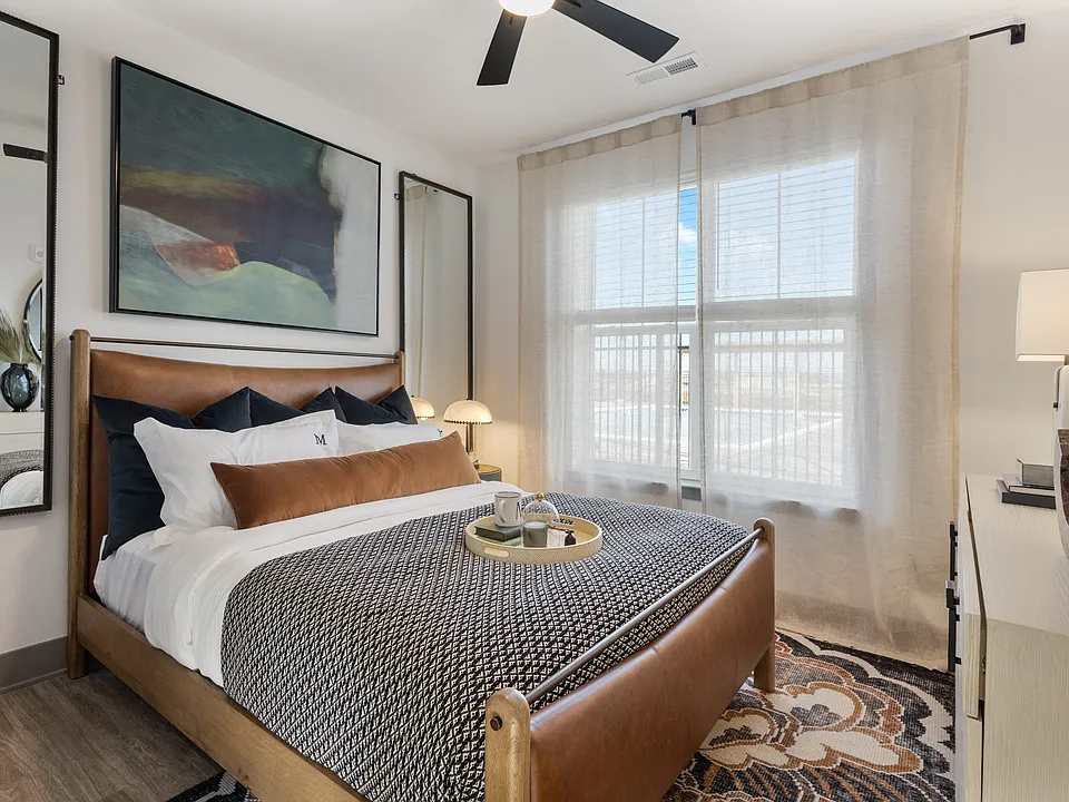 Model apartment bedroom with modern finishes at Montage West Lafayette.