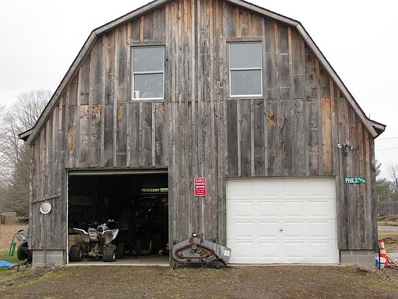 Two story garage is insulated and heated on first level.