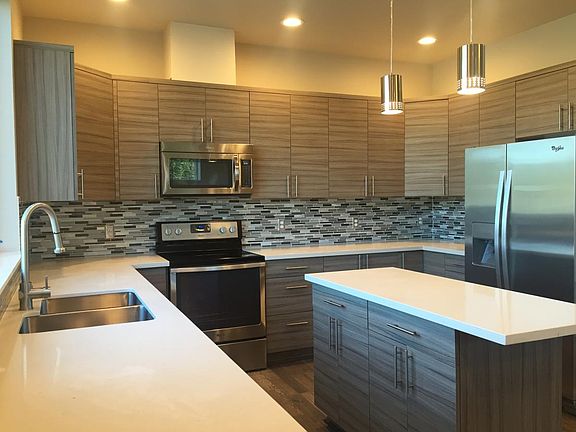 Beautiful kitchen with lots of cabinets and SS appliances