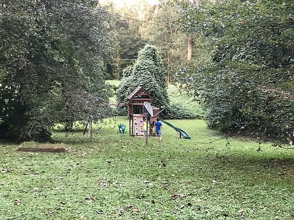 Side of house with playset 