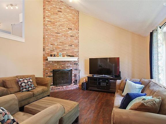 Living Room with dramatic brick fireplace.