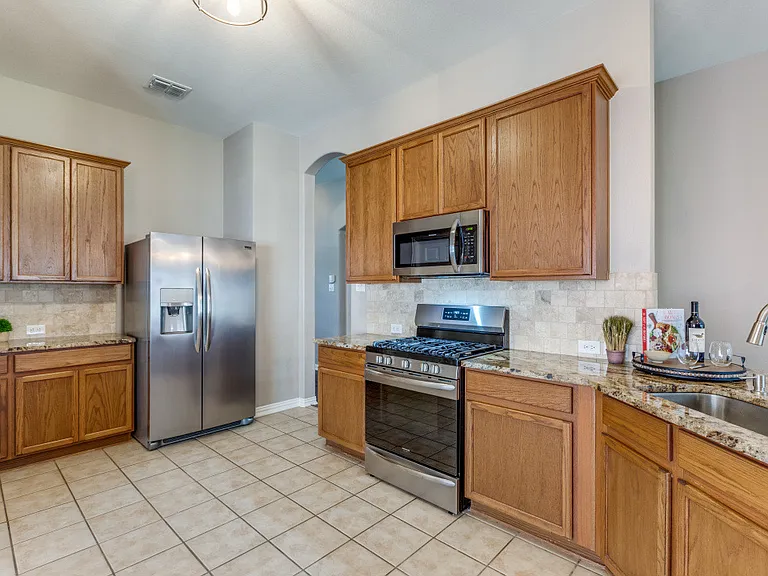 Kitchen offer a gas stove that's great for cooking hearty meals! Refrigerator is included.