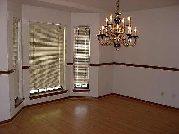 Spacious dining area with bay window.