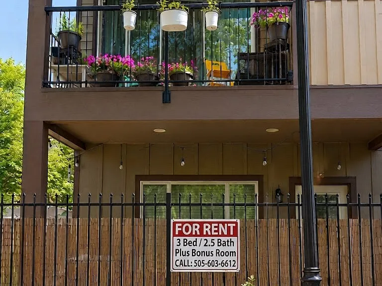 Front Entryway with patio on the first floor and balcony on the second floor