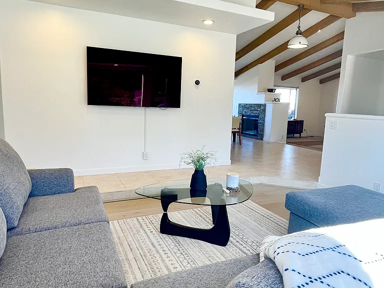 Alternative sightlines of Living room 1 into the open concept dining/living room #2