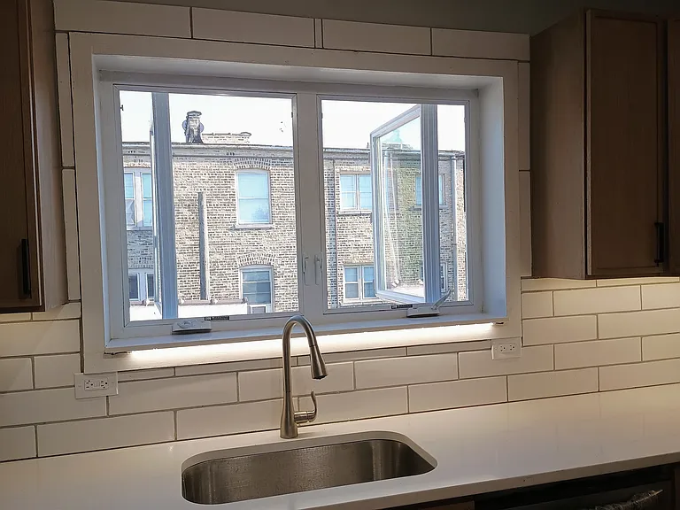South windows above nearest building for abundant natural light.