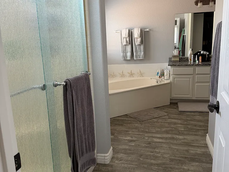 Spacious primary suite with private bath and walk-in closet.