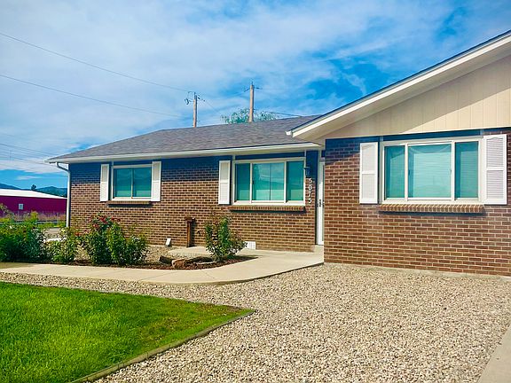 East-facing front door and grassy yard