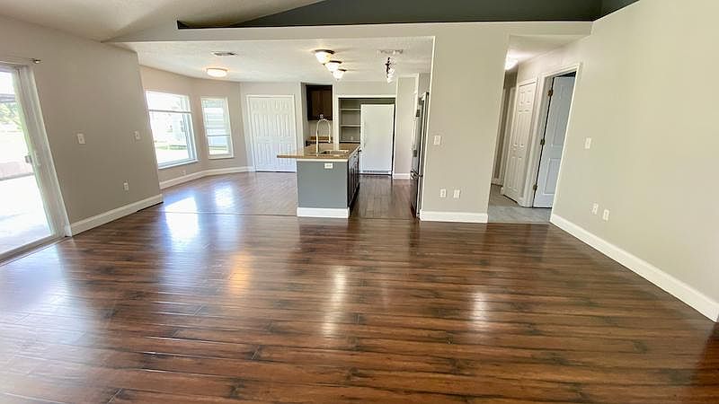 Large family/kitchen/dining combo view #4