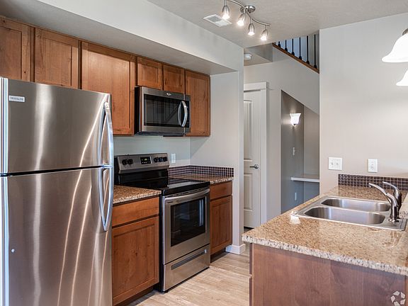 Spacious kitchen area that comes fully equipped with stainless steel appliances.