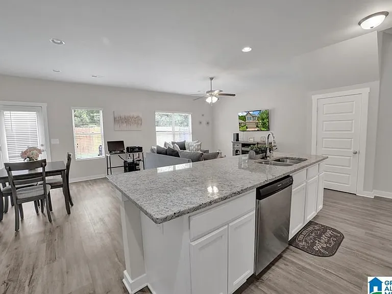 Open concept to living and dining room; extra storage under stairs