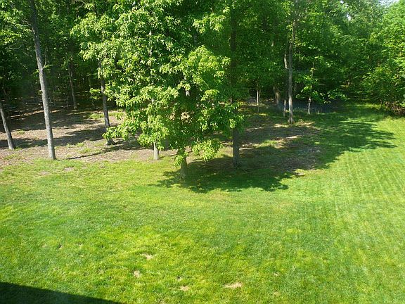Backs to acres of treed parkland