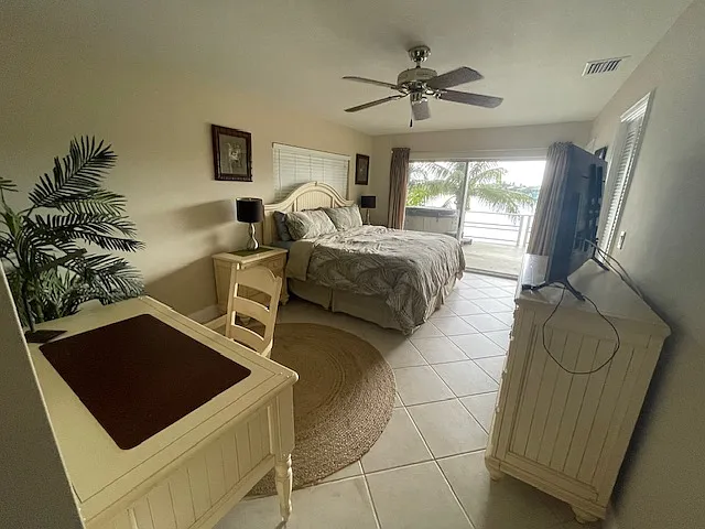 Master bedroom has a king bed right off the deck. The sunset can be enjoyed from the comfort of your suite.