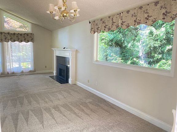 Lots of light big bay window by dining room.