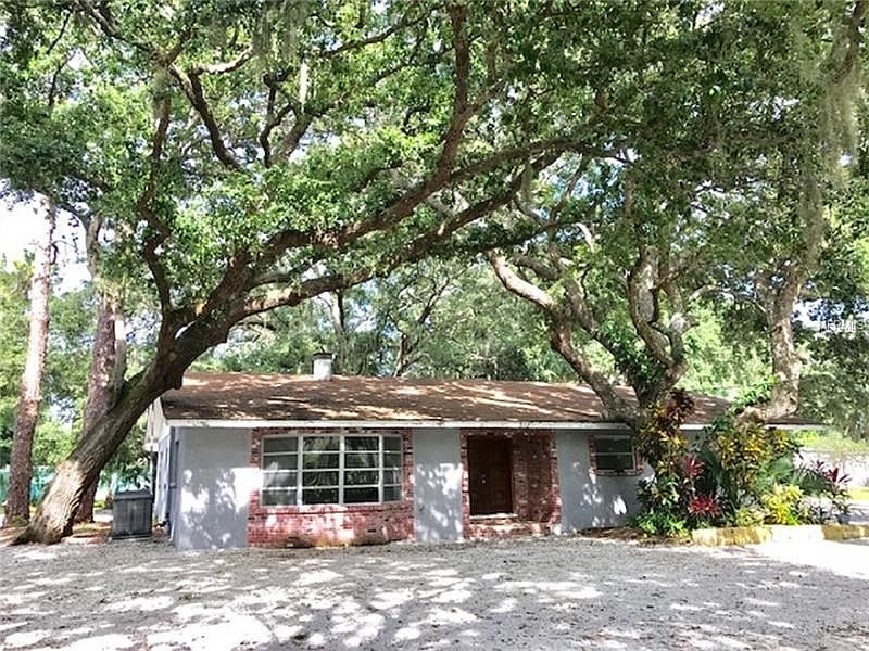 3/2 on half an acre with huge oaks trees and beautiful landscaping