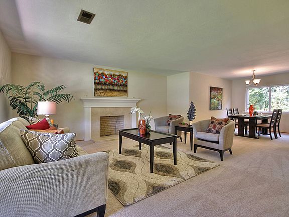 Enter into your bright & open formal living room/dining combo