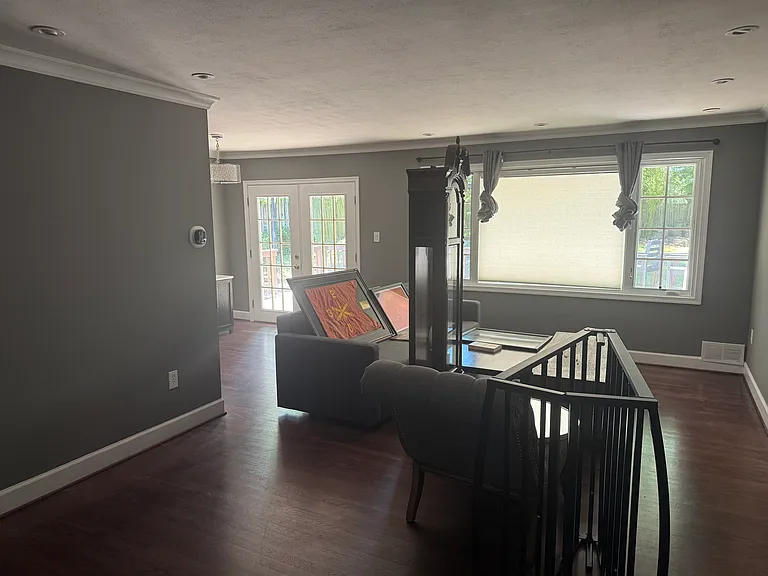 Middle Floor living room - view coming into the front door. The back doors lead to the back patio deck.